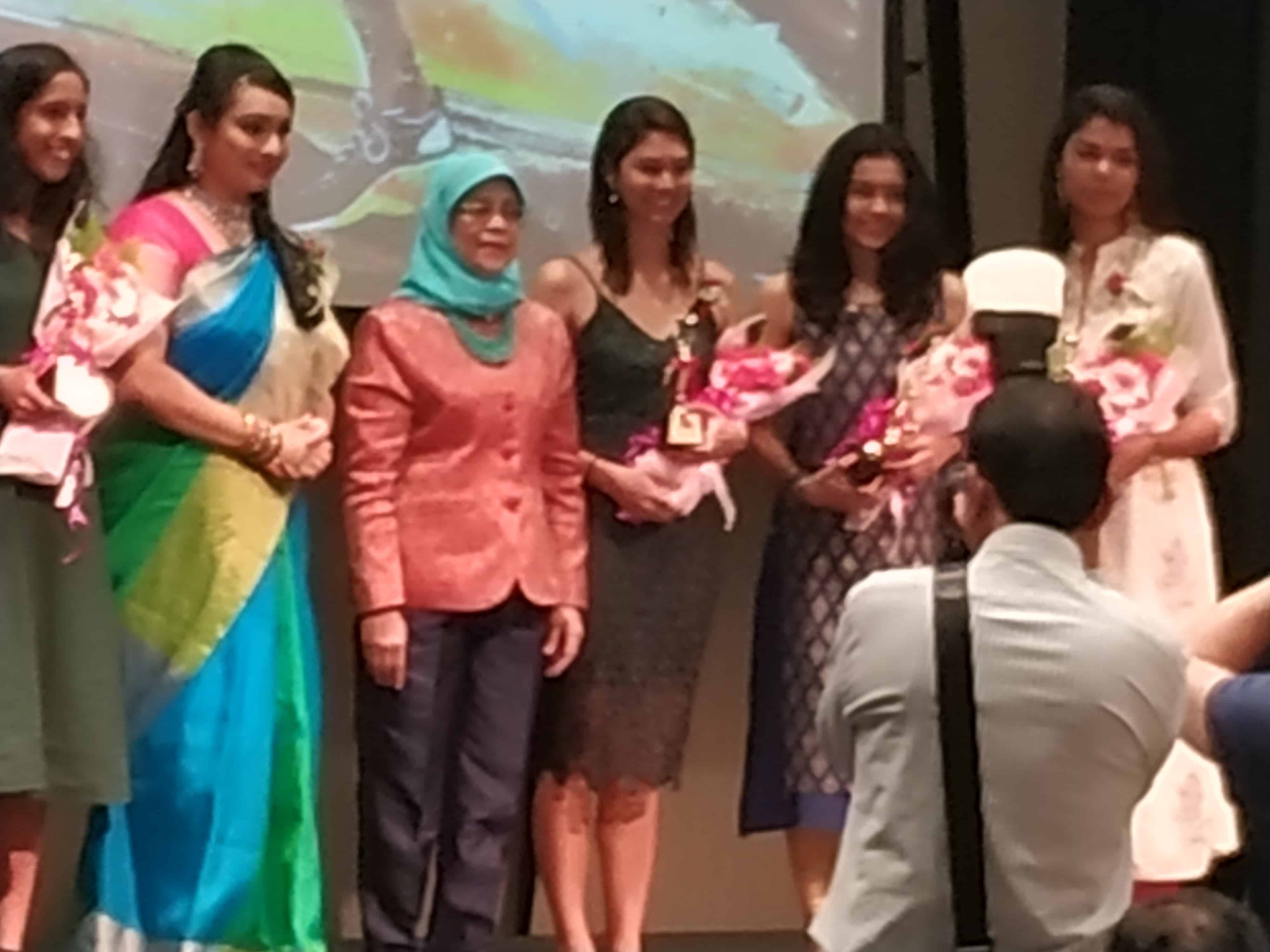 President Halimah Yacob (third from left) with Ms Joyce Kinsgly, second from left, and award winners